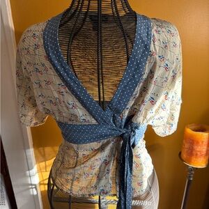 Elegant Floral Wrap Blouse with Blue Accents